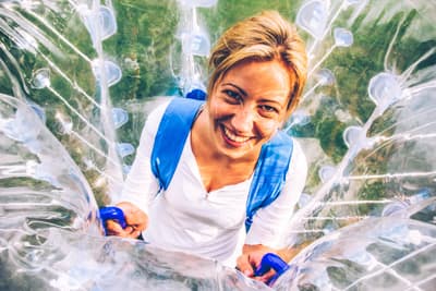 Girls playing bubble soccer